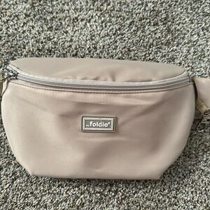Like new beige foldie crossbody sling bag